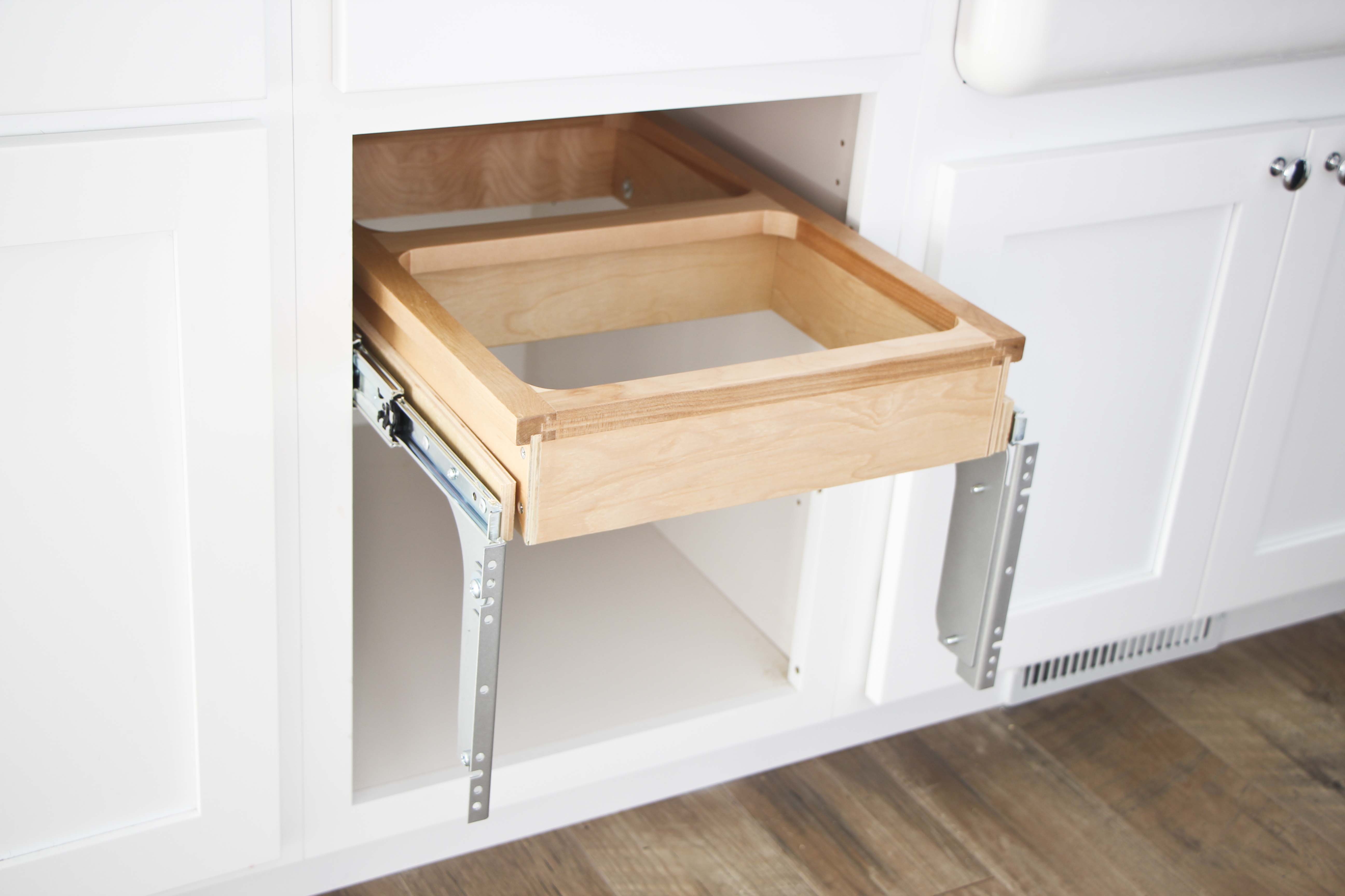 How to install a pull-out bin in a kitchen cupboard