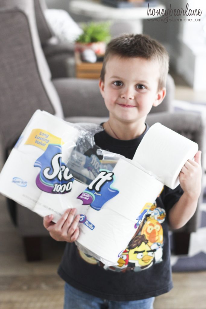 boy holding toilet paper