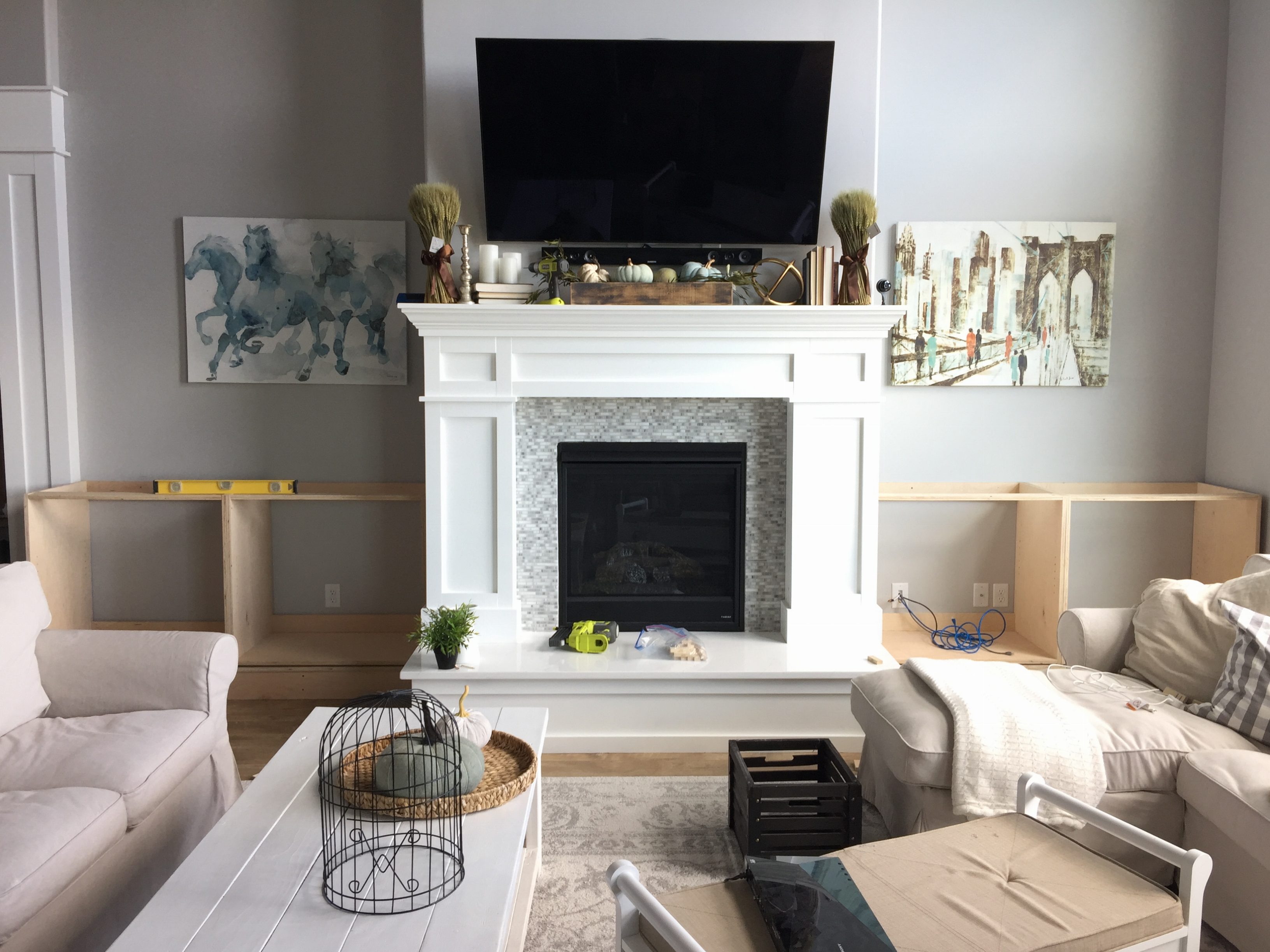 Built in deals cabinets beside fireplace