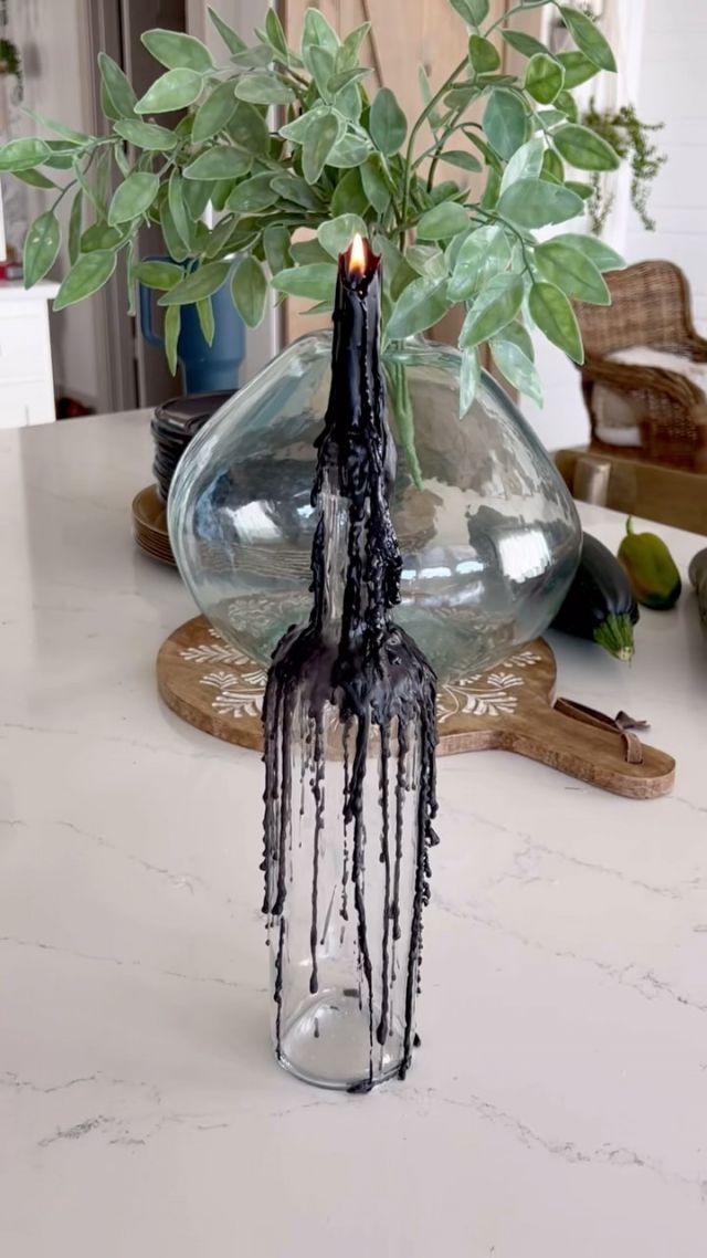 NEED A HALLOWEEN CENTERPIECE? 🎃👇🏻

I have used these drippy candles in bottles as a centerpiece for many years now but this year they are the drippiest ever! 

This year I bought some drippy candles on Amazon (most candles are dripless) and even though they did drip a lot, they still needed help to make a nice evenly dripped bottle.  I used a regular black candle to melt more of the drippy candle and I love the thick black wax it created. 

These drippy candles also burn down very quickly so I will probably also have to use a regular candle instead.  I melt both black and white candles and group them together for a cool, spooky gothic effect! 

#gothichalloween #halloweentablescape #drippycandles #drippy