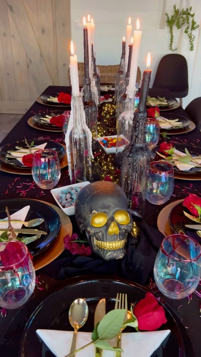 🎃🎃🎃HALLOWEEN DINNER PARTY🎃🎃🎃

Start with a good quality fabric for a tablecloth.  I used this sheer black power mesh fabric from @fabricwholesaledirect as a base and also as an overlay for the center.  It worked great because I was able to put the battery powered twinkle lights inside the mesh fabric and it looked like magical floating lights! 

After I laid the base for the table, I grouped my drippy candle bottles along the center.  Then I laid out good chargers, black ceramic plates, gold plastic silverware, and white napkins. 

I always like to buy some cheap flowers at the grocery store to elevate the table setting.  The roses I found on clearance for only $2.50!  I laid a rose across each plate, then scattered mums and petals all around the table.

The finishing touch was these iridescent goblets dipped in red dyed corn syrup which dripped down to look like blood.  It’s sticky so I also provided straws with these! 

My friends brought some delicious food, drinks, and dessert so my main job was just the decor!  It was so fun to put this together! 

#halloweendinnerparty #halloweenpartyideas #halloweentablesetup #spookytable #october31 #dinnerparty #falltablescape